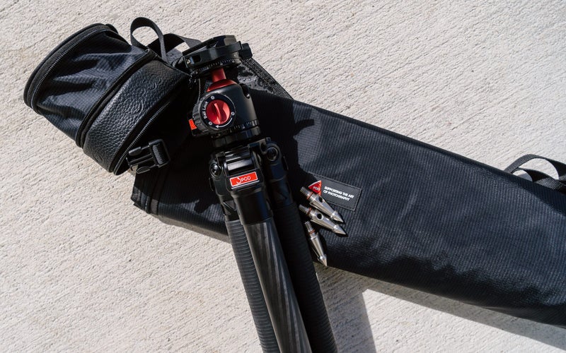 A black 3Pod Everest T5 carbon fiber tripod rests on a black carrying case.