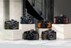 Six different colors of the retro-looking Nikon Z f scattered on podiums of different heights