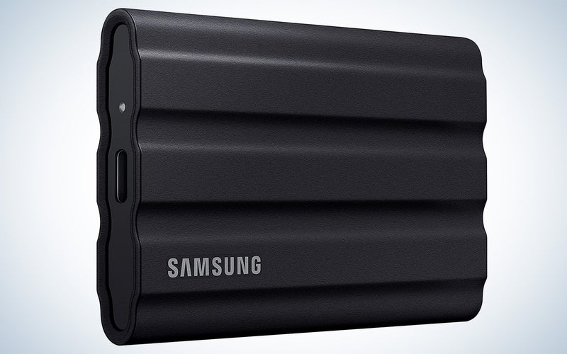 Samsung T7 Shield portable SSD drive on a plain background