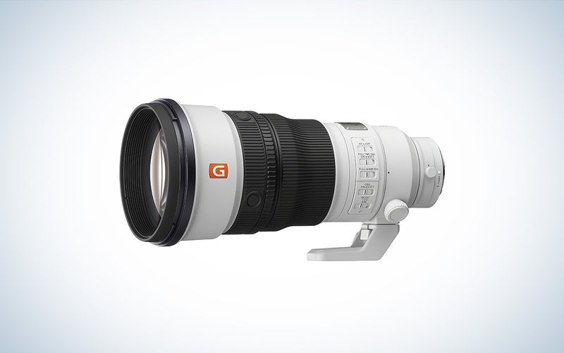 The Sony FE 300mm f/2.8 GM OSS is placed against a white background with a gray gradient.